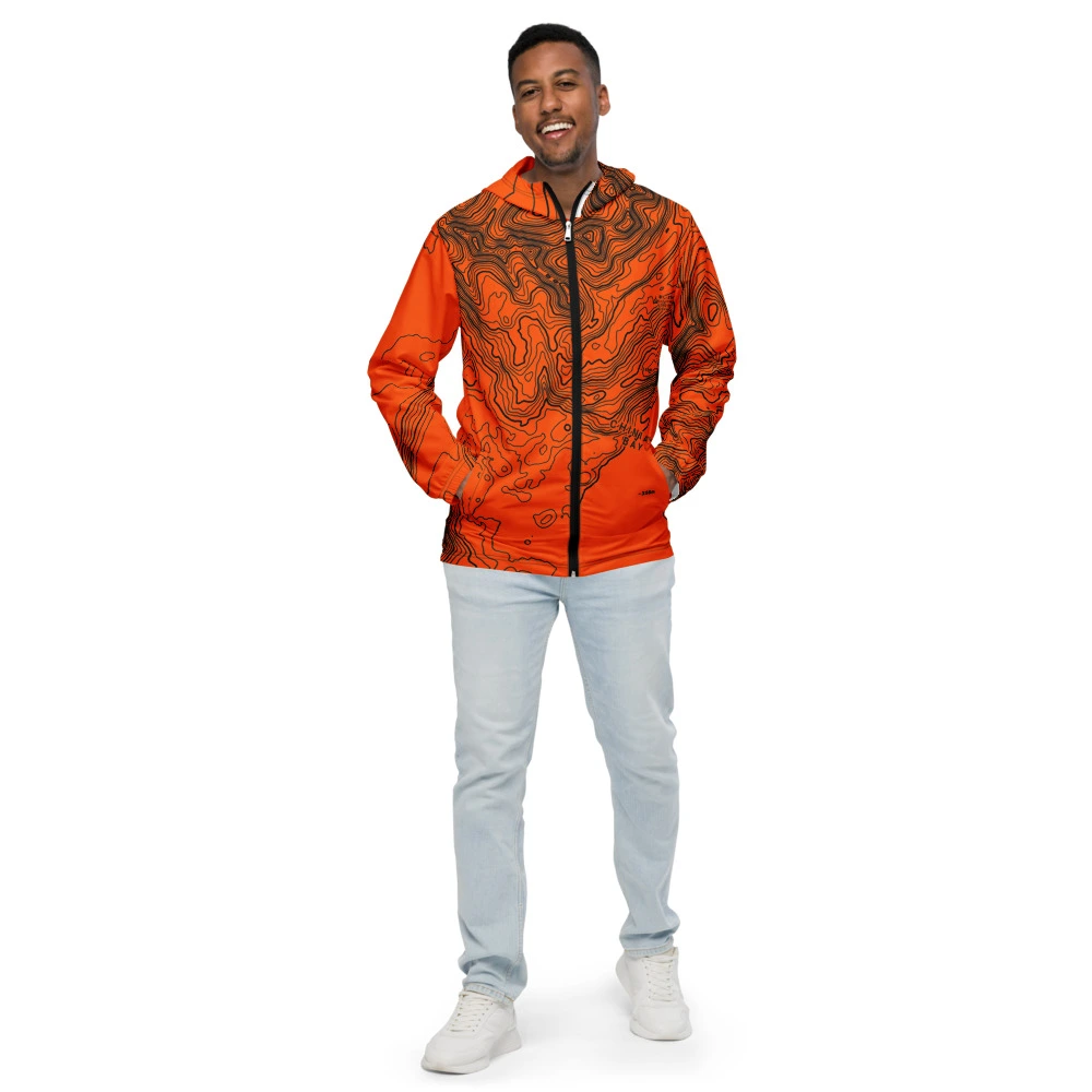 Real garment mockup of Kodiak Chiniak Bay Pillar Mountain Alpine Neon Topo Windbreaker, Safety Neon Orange view 1